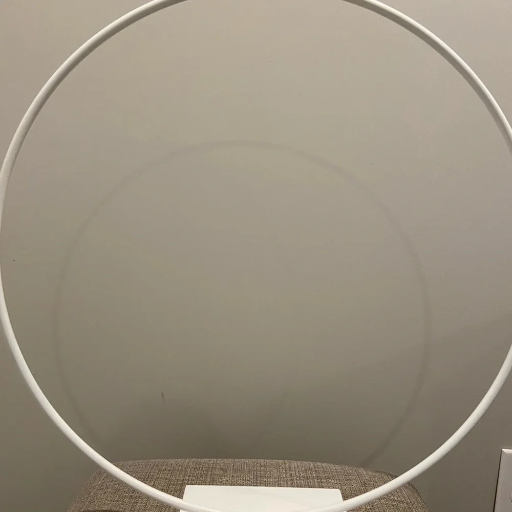 Cake hoop used for 3 tier cake made of iron and painted white. Has a sturdy base